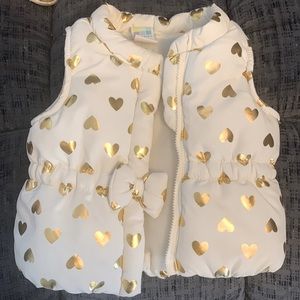 Kid vest with hears and bow.